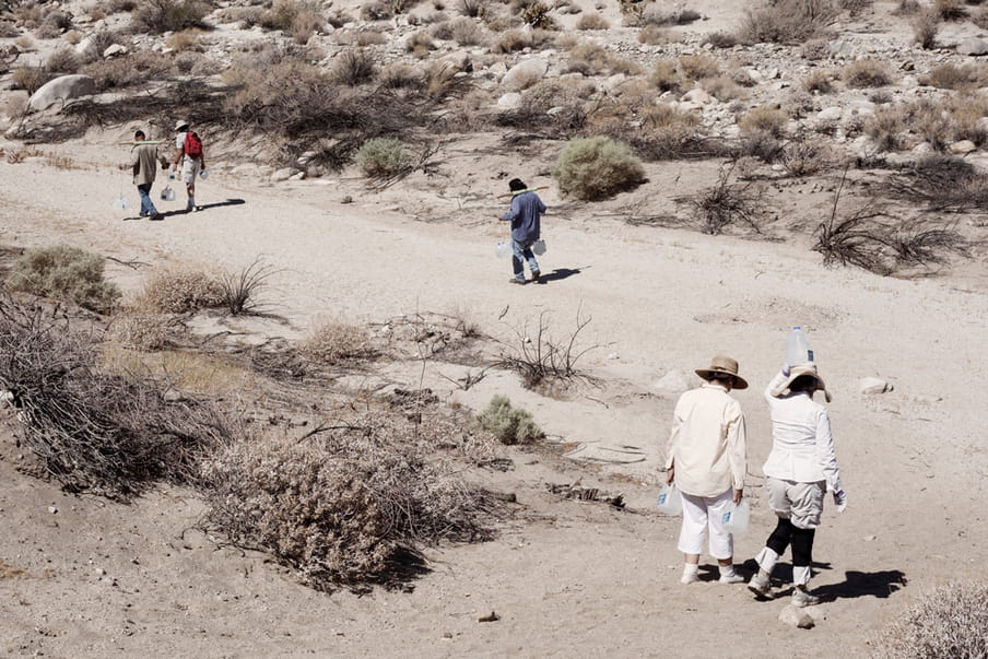 The Water Station volunteers walking in the Yuma Desert to bring water to the different stations.