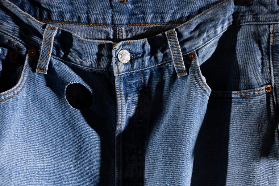 Photo of a pair of jeans with a bit taken out