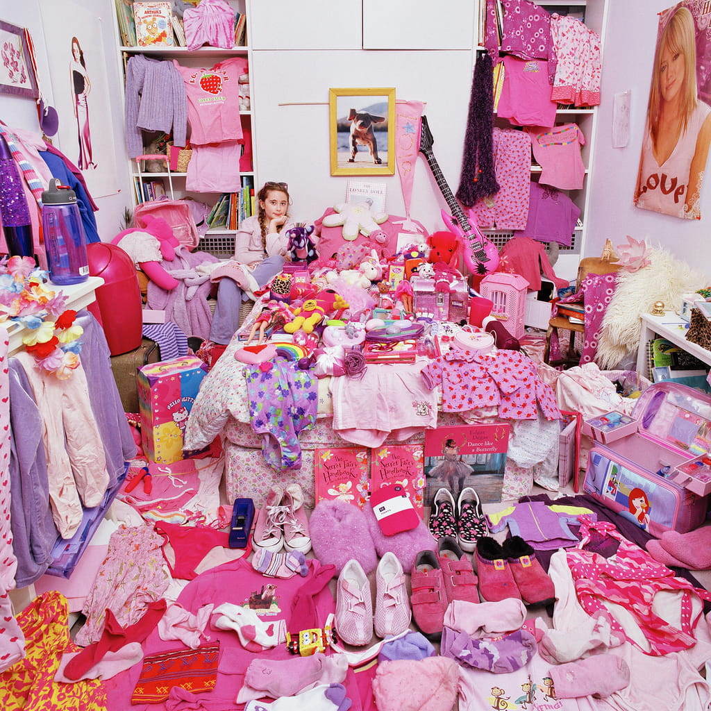 Photo of a girl surrounded by pink items