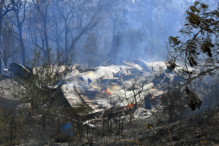 A destroyed home is seen after a bushfire past through, in Buxton, New South Wales, Australia, 19 December 2019. Temperatures above 40 degrees Celsius and strong winds are fanning a number of fires around Sydney. 