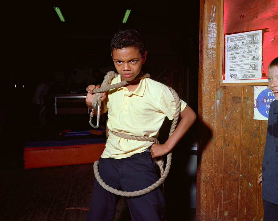 Photo of a kid at the center playing with a rope.