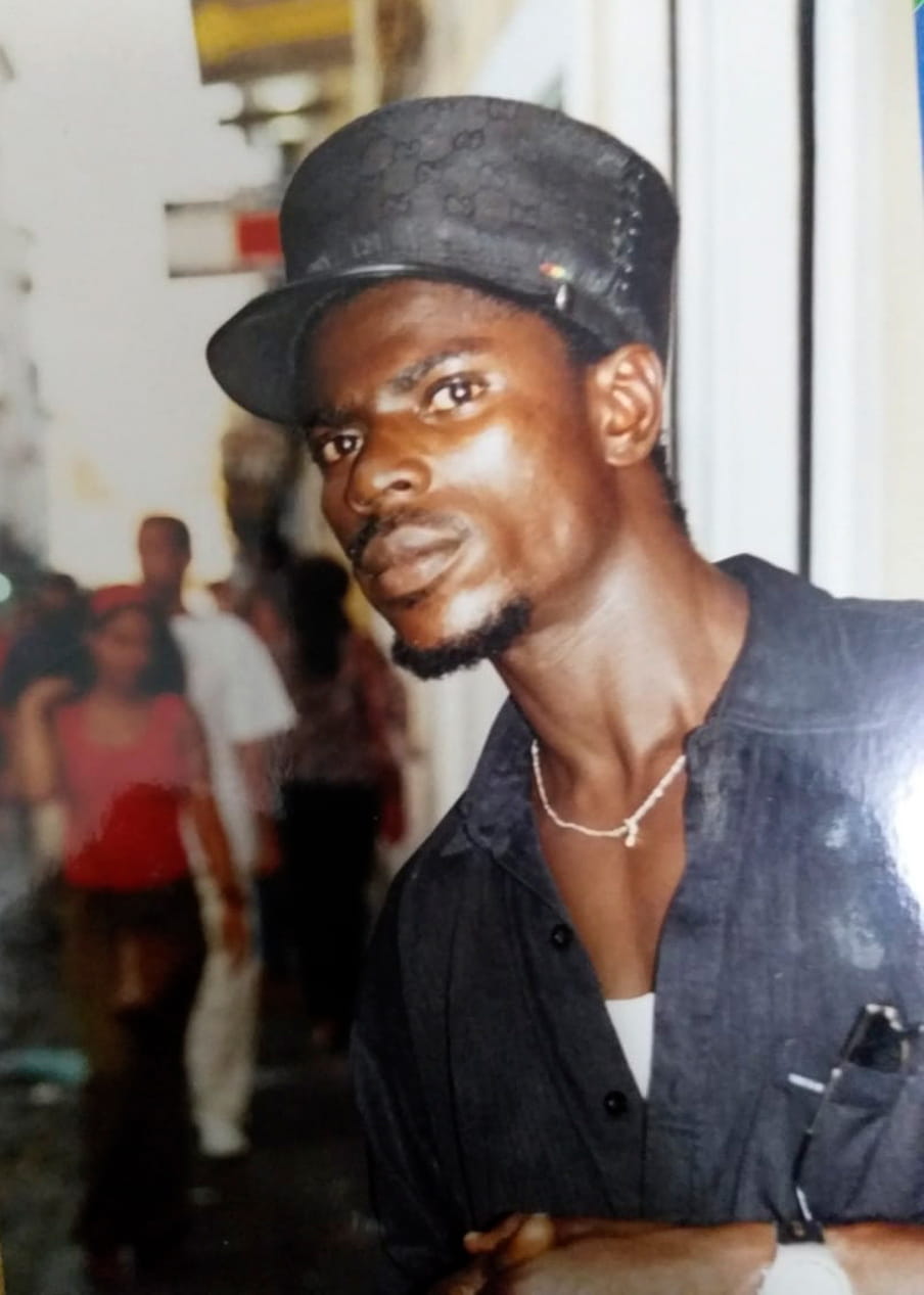 Photo of a young man wearing a cap