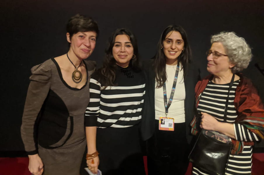 This is a picture of four women standing next to each other, with the correspondent Irene Caselli to the left.