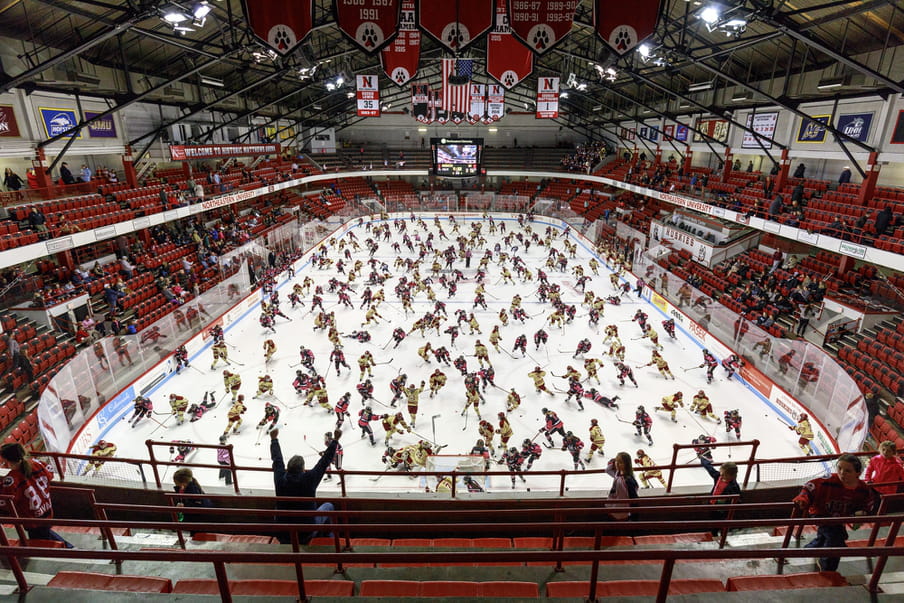 Photo-montage of an ice hockey game, heavily crowded with players.