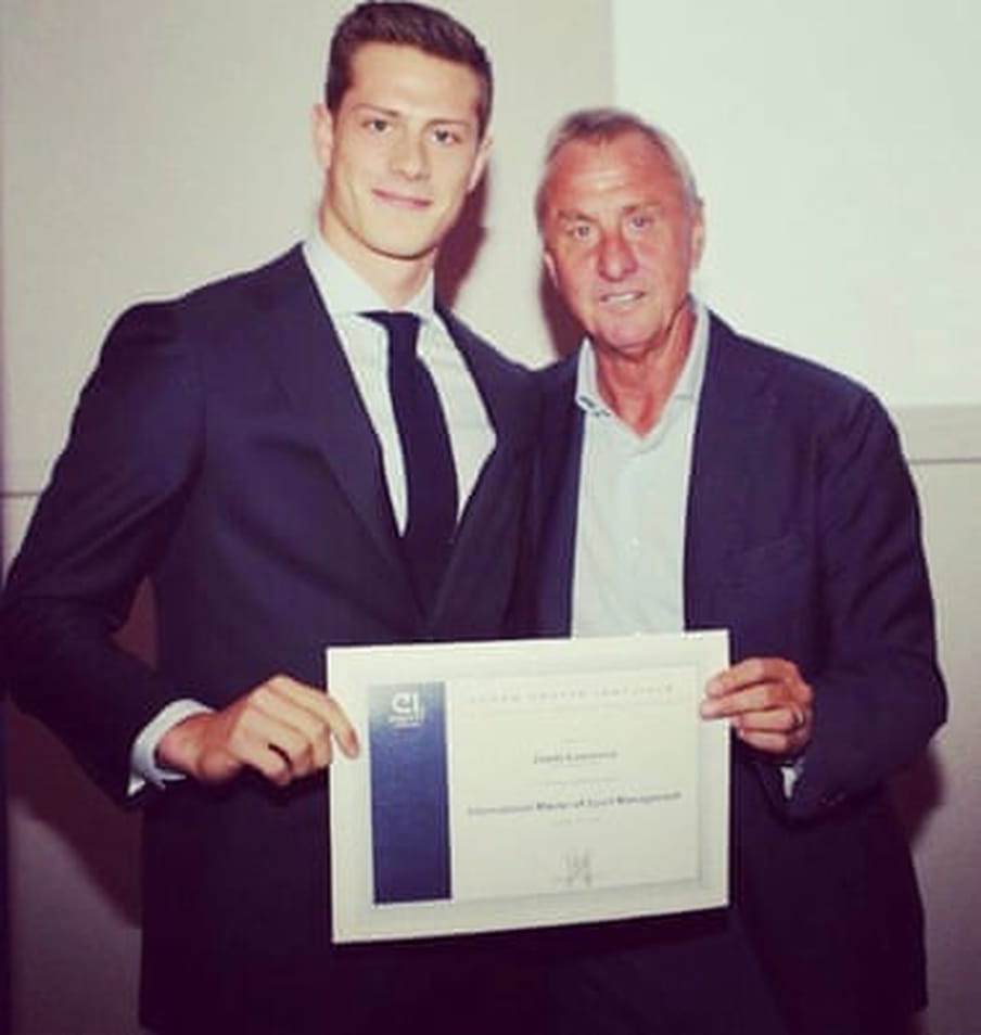 Polaroid style photo of Steve Lawrence (on the left) receiving his diploma from the Dutch football legend Johan Cruijf (on the right). 