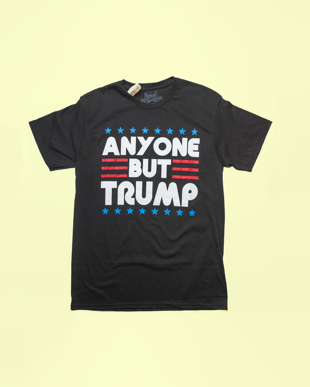 Photo of a black T-shirt with the text ‘Anyone but Trump’