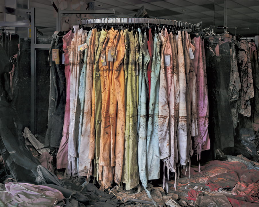 Photo of a rack of pants, destroyed by water damage