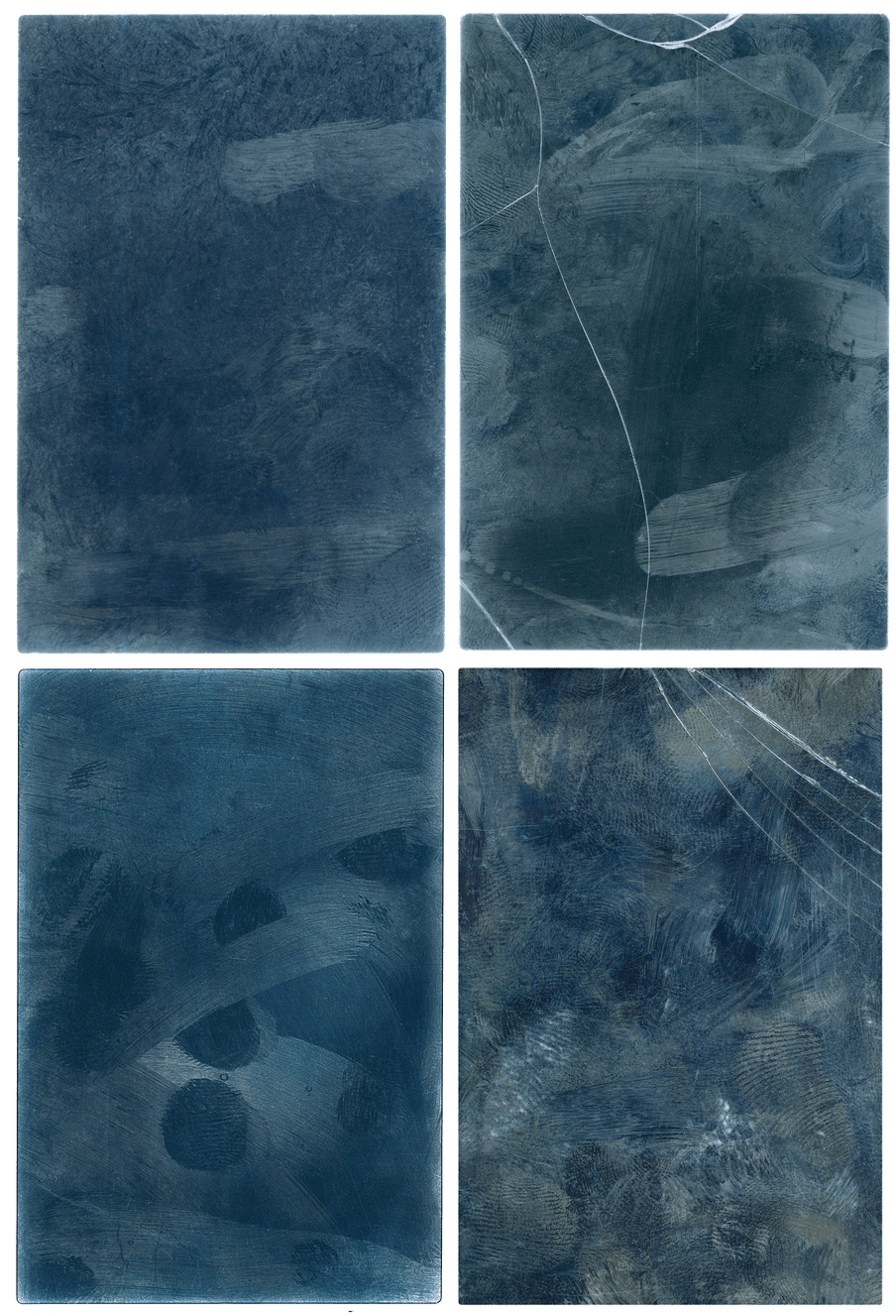 Rectangles of blue side by side in a 2:2 formation. They are dark blue with lighter whiter smudges on them; to the right both images have glass cracks running through them