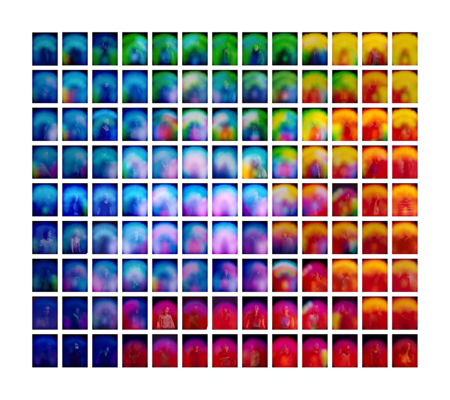 Grid of portraits, all people are covered with slightly different color glows.
