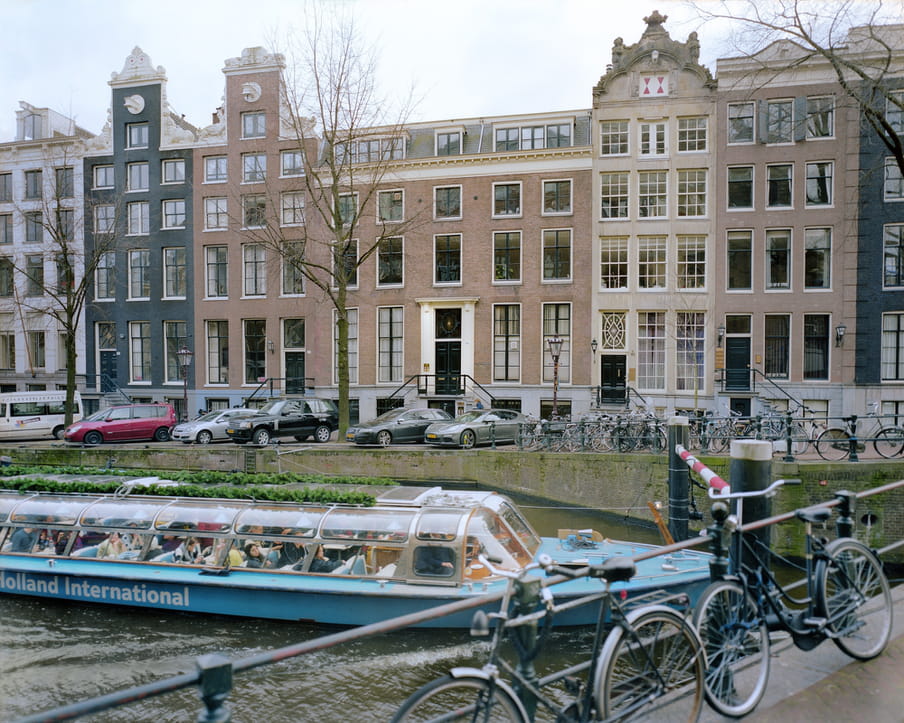 Picture of a canal with a tourist boat