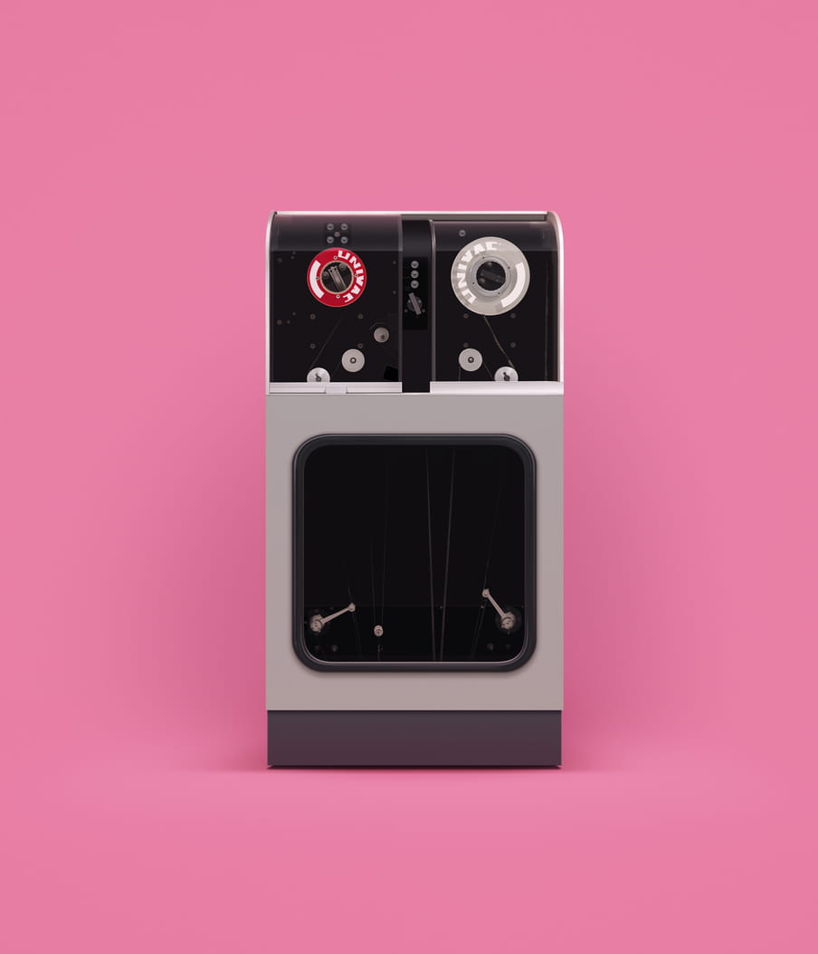 Photo of an old computer against a pink background
