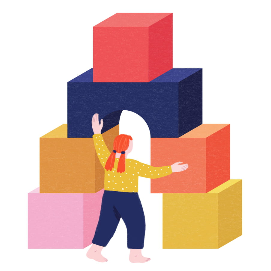 Illustration of the back of a barefoot, red-headed child with two ponytails at the back, wearing a mustard coloured top with white polka dots and blue trousers, playing with giant pink, orange, blue red and mustard coloured blocks, shaped as an arch. Her arms are outstretched at the top of the doorway made by the blocks, and to the right hand side. It looks like she might be passing through.