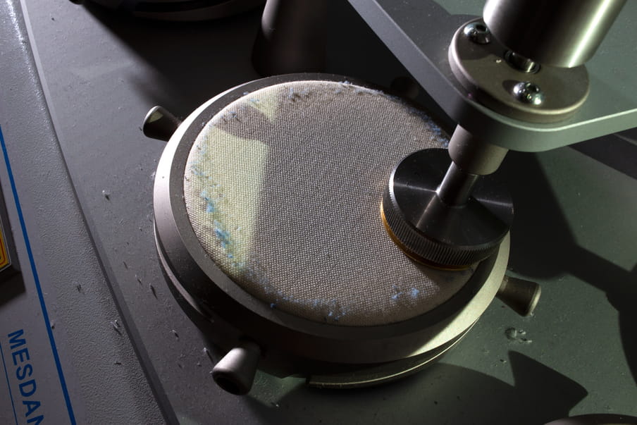 Photo of a machine working with fabric parts