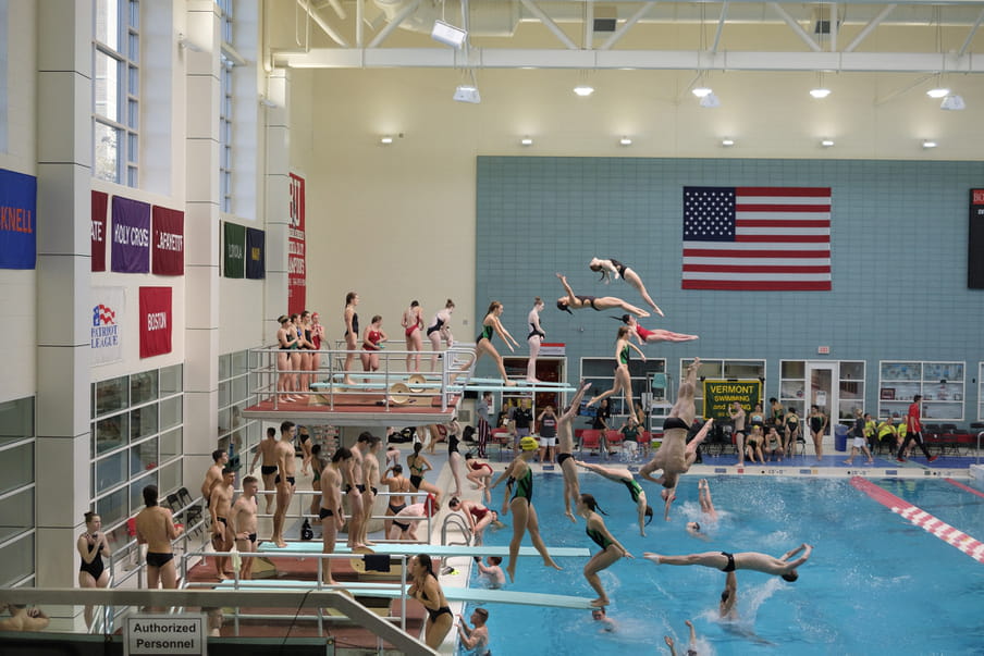 Photo-montage of heavily crowded female diving competition.