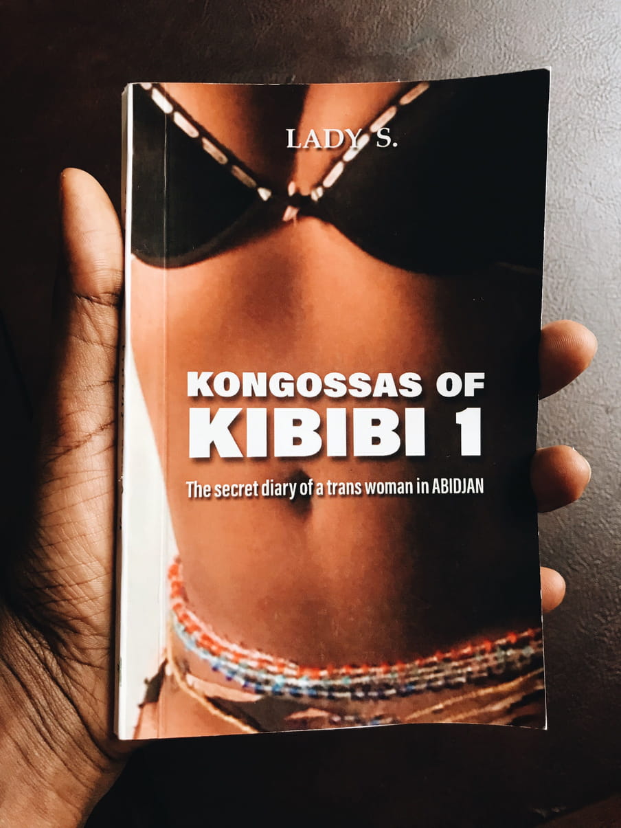 Photo of a hand holding a book with the title Kongossas of Kibibi 1