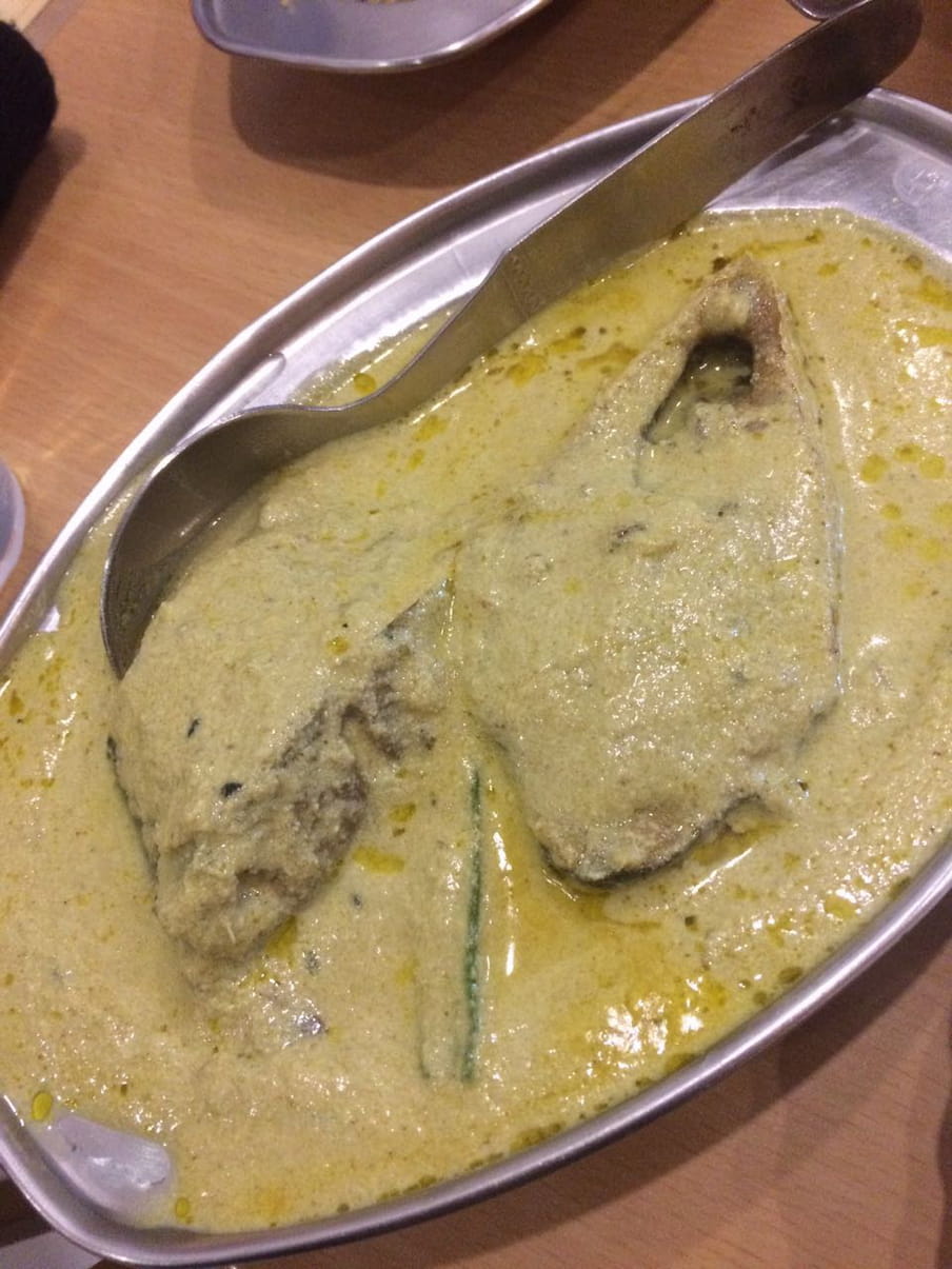 A plate of hilsa fish cooked in east Indian style mustard-paste base.