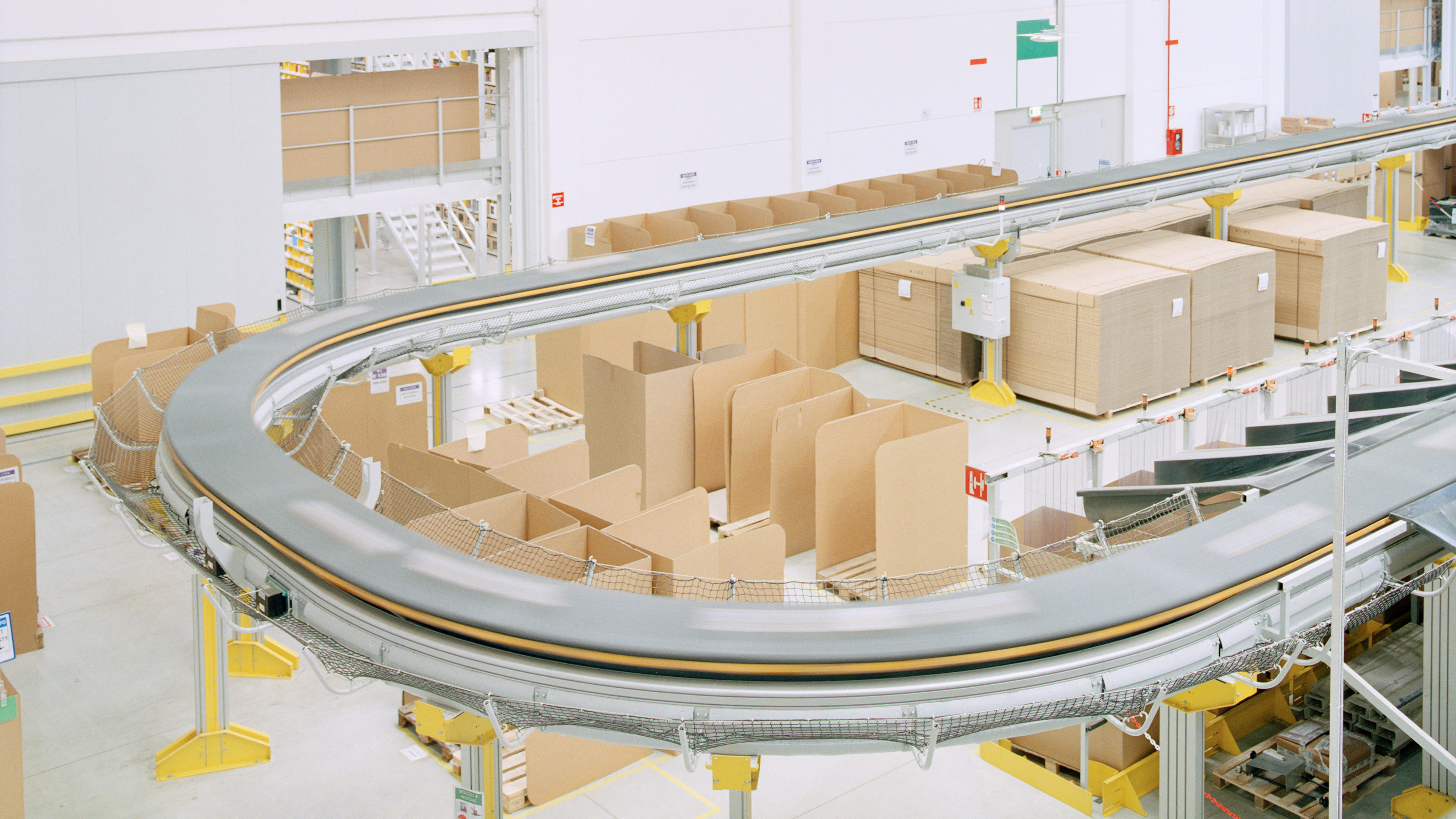 Colour photograph of a warehouse showing boxes.