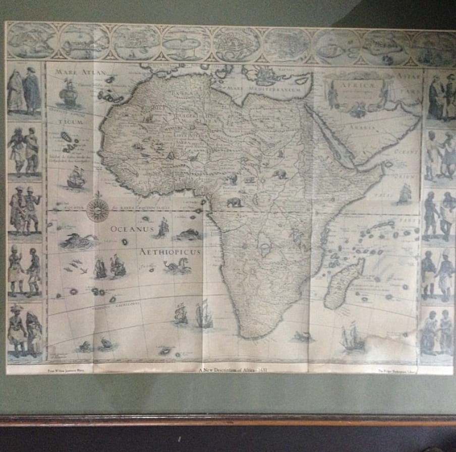 A photo of an old map of Africa with faint text on it.