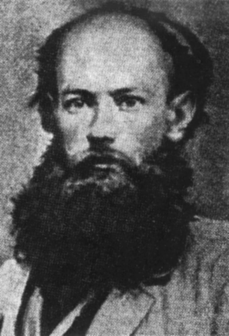 Black and white portrait of a man with a beard.