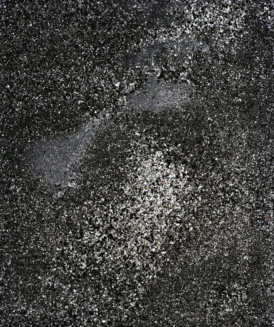 Photograph showing human remains in the form of black and white ash
