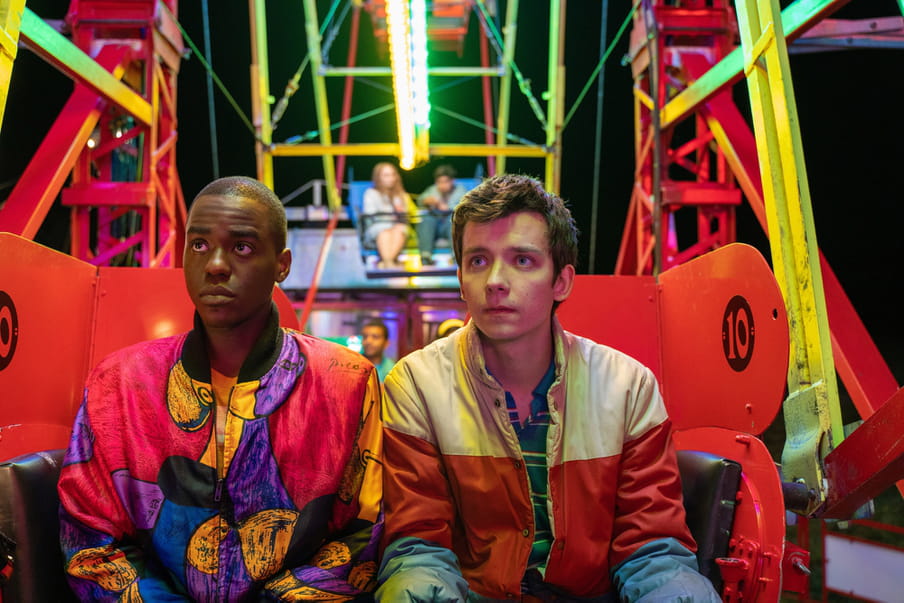 Screenshot from the series Sex Education showing two boys sitting in a ferris wheel.