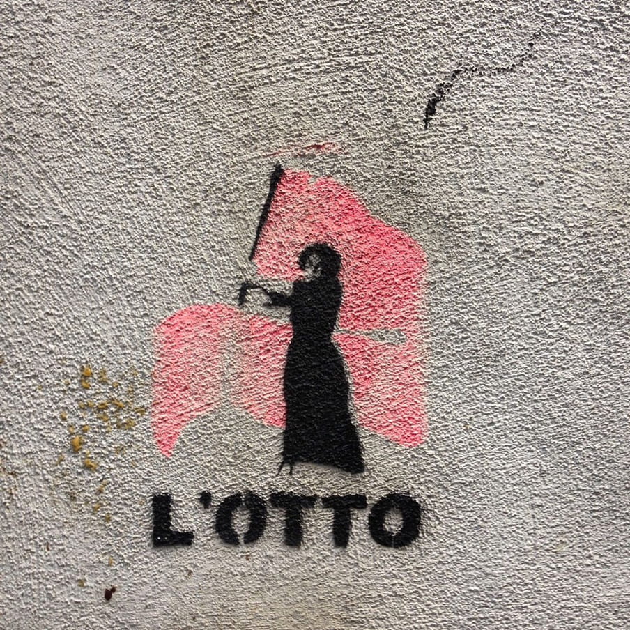 A stencil of a black silhouetted woman waving a pink flag.