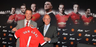 Louis van Gaal and Sir Bobby Charlton pose with a Manchester United jersey during Van Gaal’s first press conference after becoming the new manager of United. 
