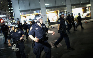 Police officers during a Black Lives Matter demonstration in New York City on July 8, 2016. Photo by Kena Betancur / AFP