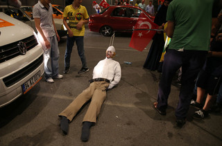 An effigy of Islamic cleric Fethullah Gülen gets dragged along the ground at Atatürk National Airport in Istanbul on July 17, 2016. Photo by Berk Ozkan / Anadou