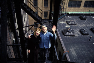USA. New York City. 1997. People on fire escape wearing masks of Bill and Hillary Clinton. Photo: Magnum Photos / Hollandse Hoogte