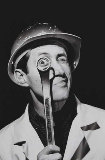 A workman peers through a ring spanner or wrench, 1994. Photo by Alfred Gescheidt / Getty Images