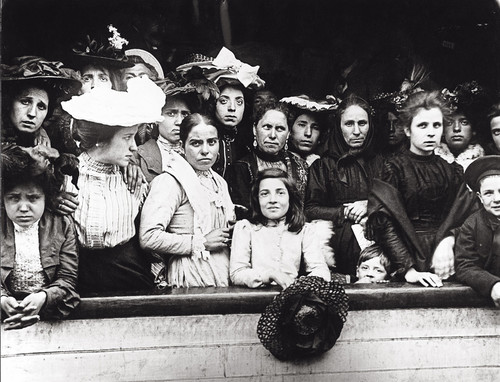 Immigrants on board a ship arriving in New York, 1910. Photo by Getty